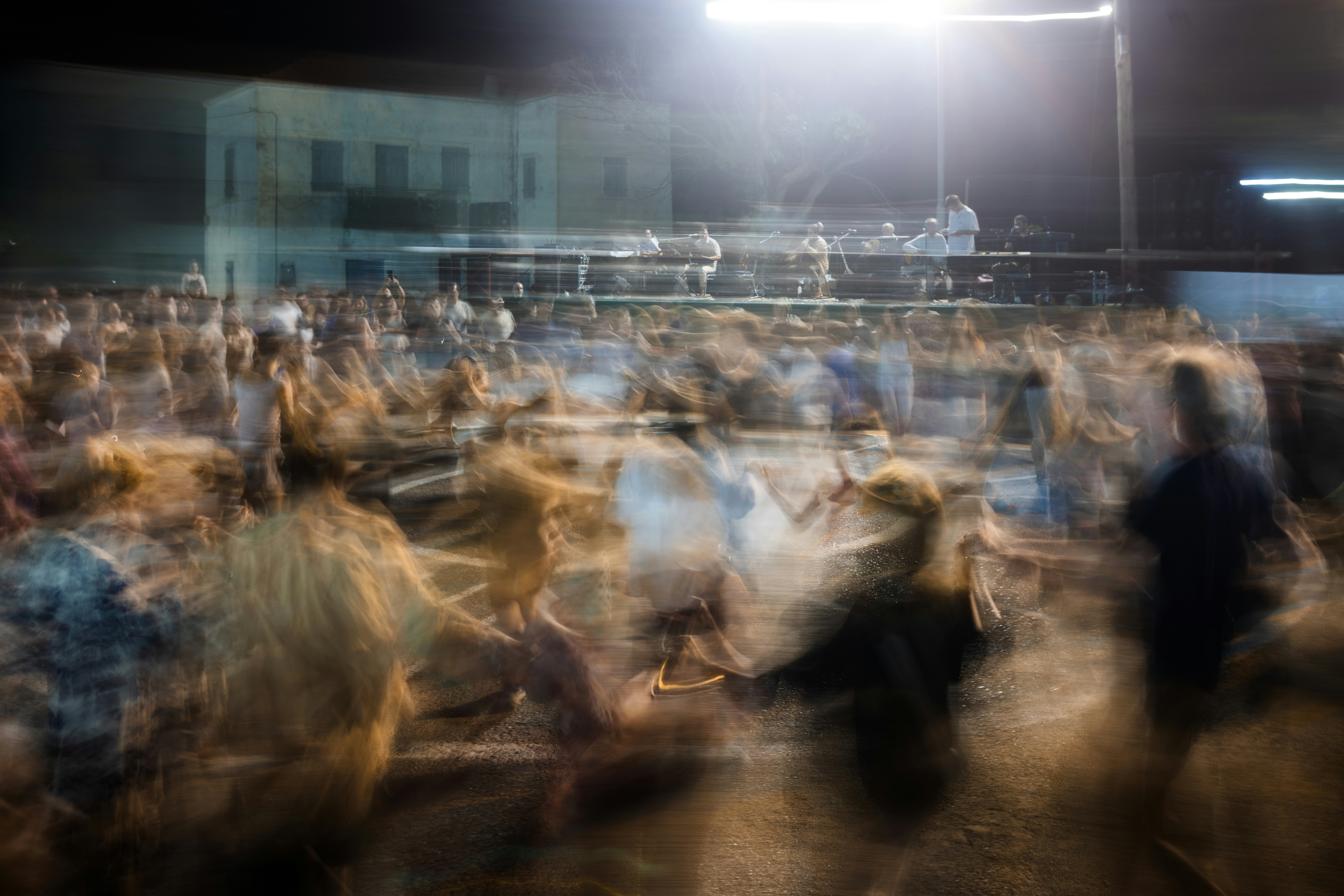 Blurry crowd at night with bright lights
