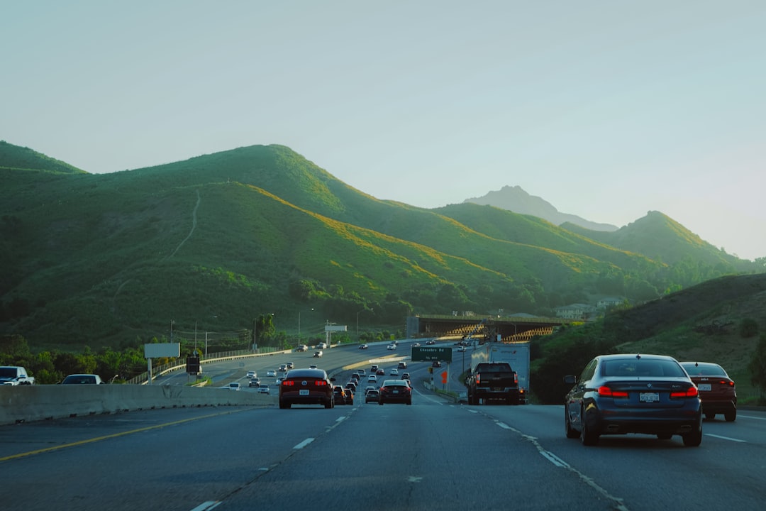 Vehicles lined up on scenic mountain road