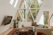 Modern a-frame living room with forest view