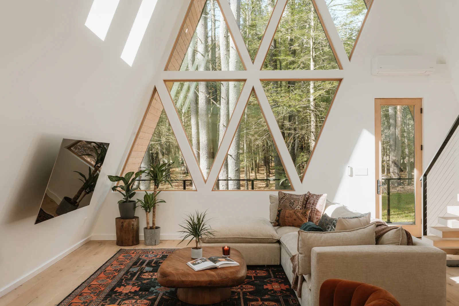 Modern A-frame living room with forest view
