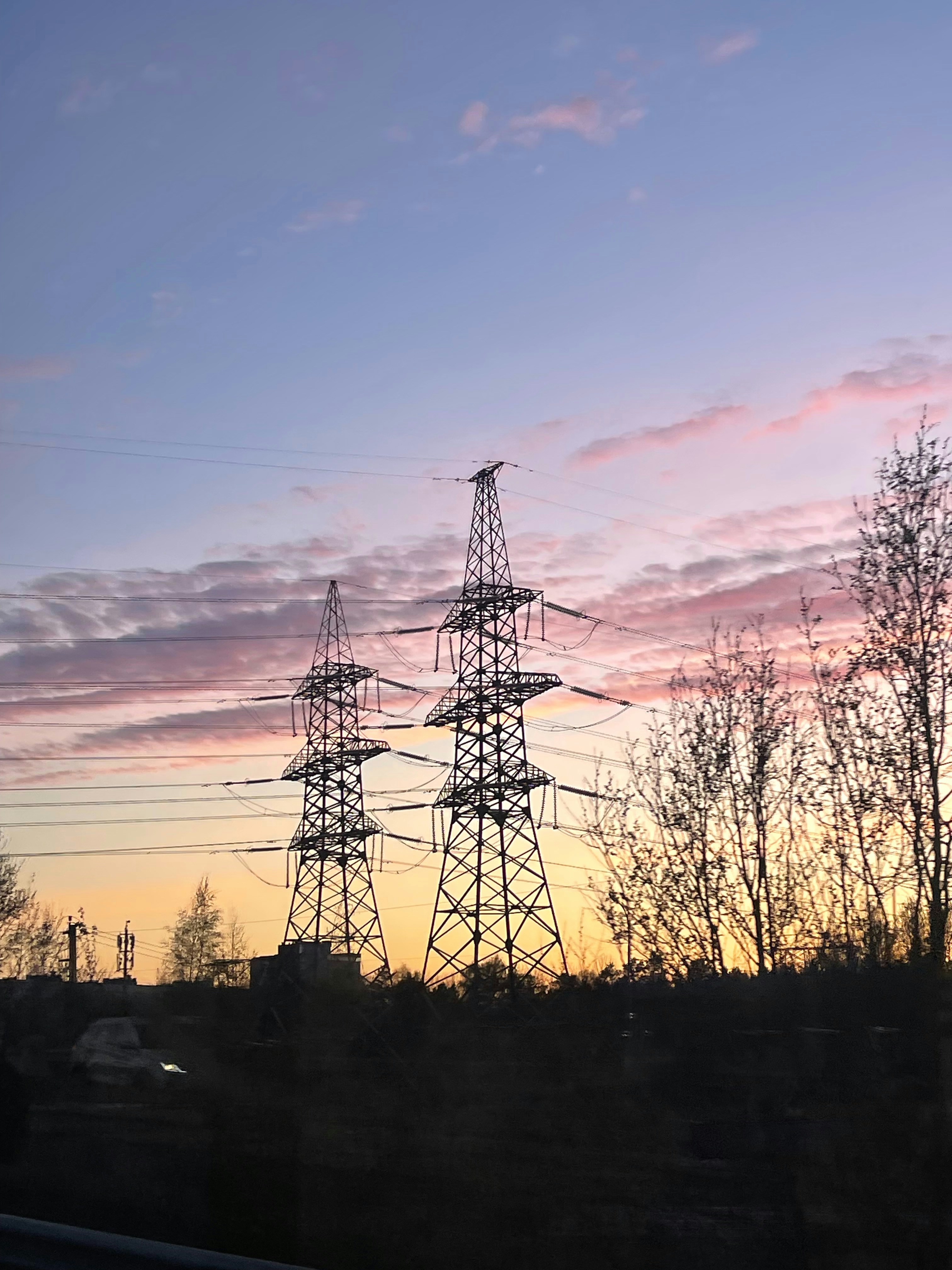 High voltage transmission lines at sunset