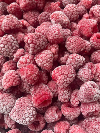 Frozen raspberries close-up background