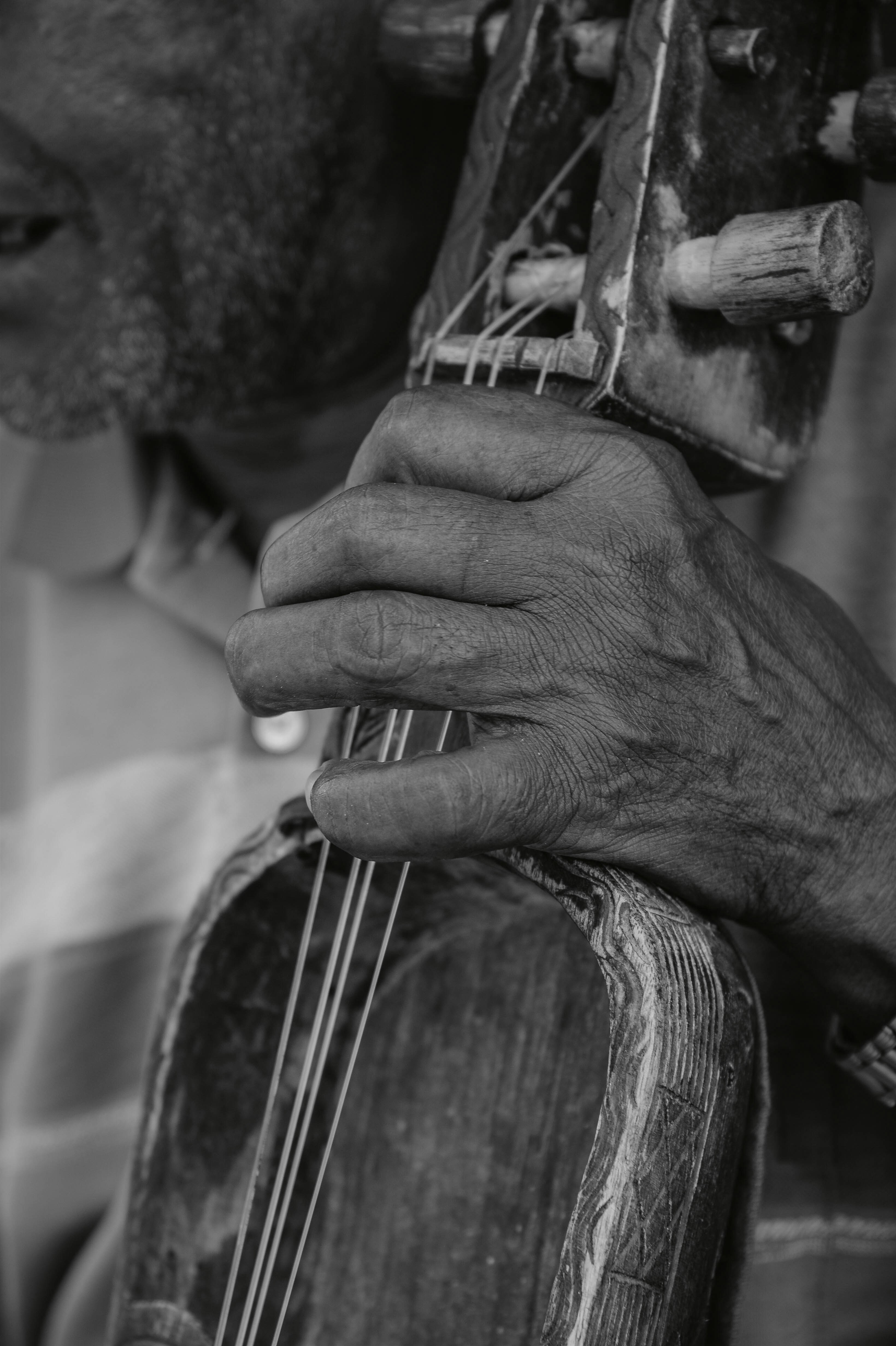 Man playing a traditional stringed instrument