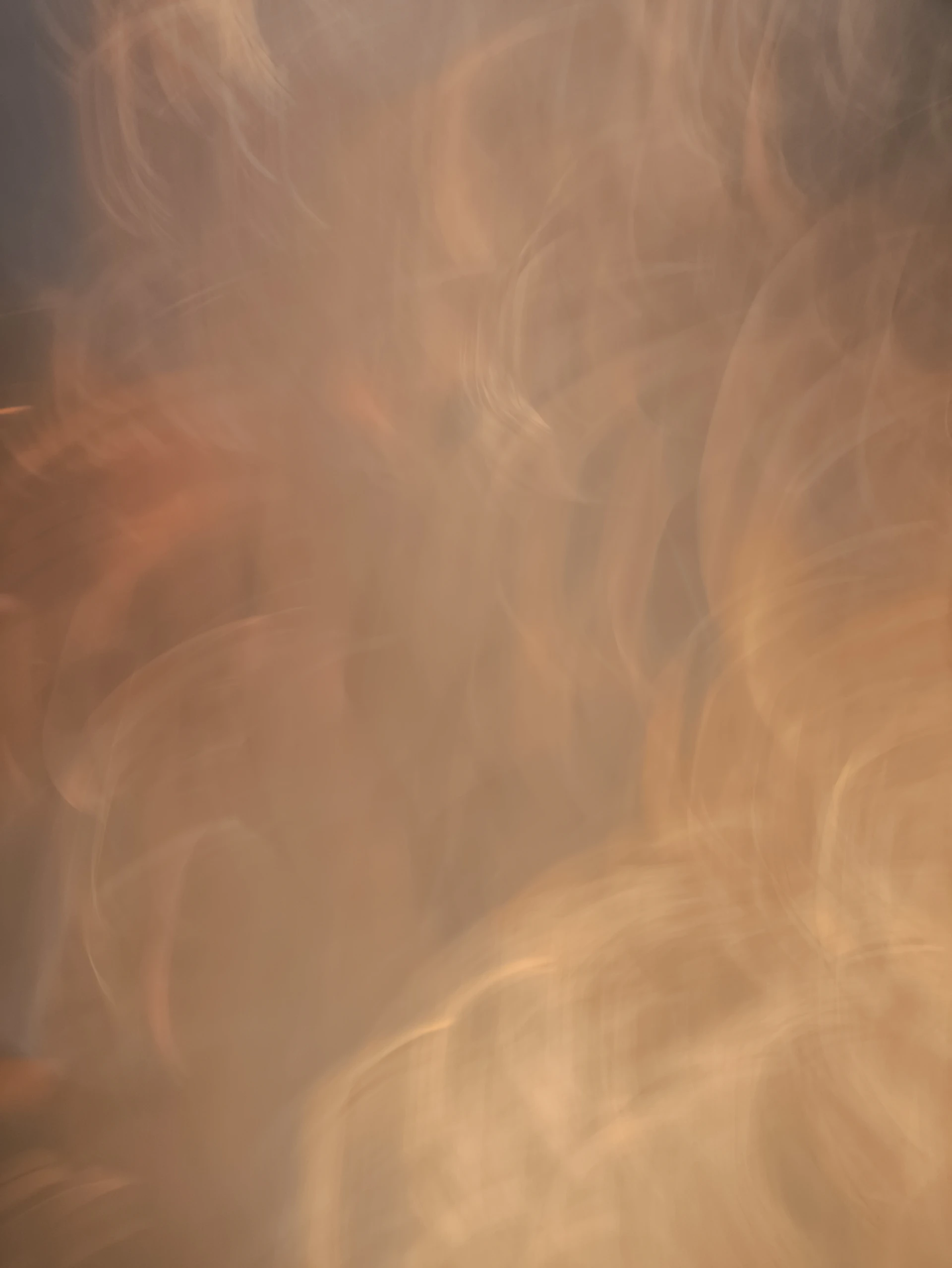 Abstract light patterns in warm, hazy tones