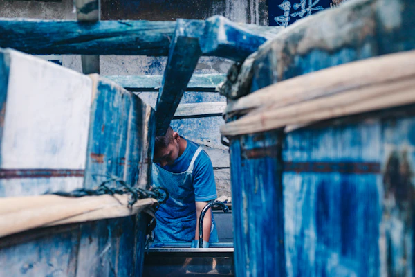 Worker dyeing fabric in vivid colour