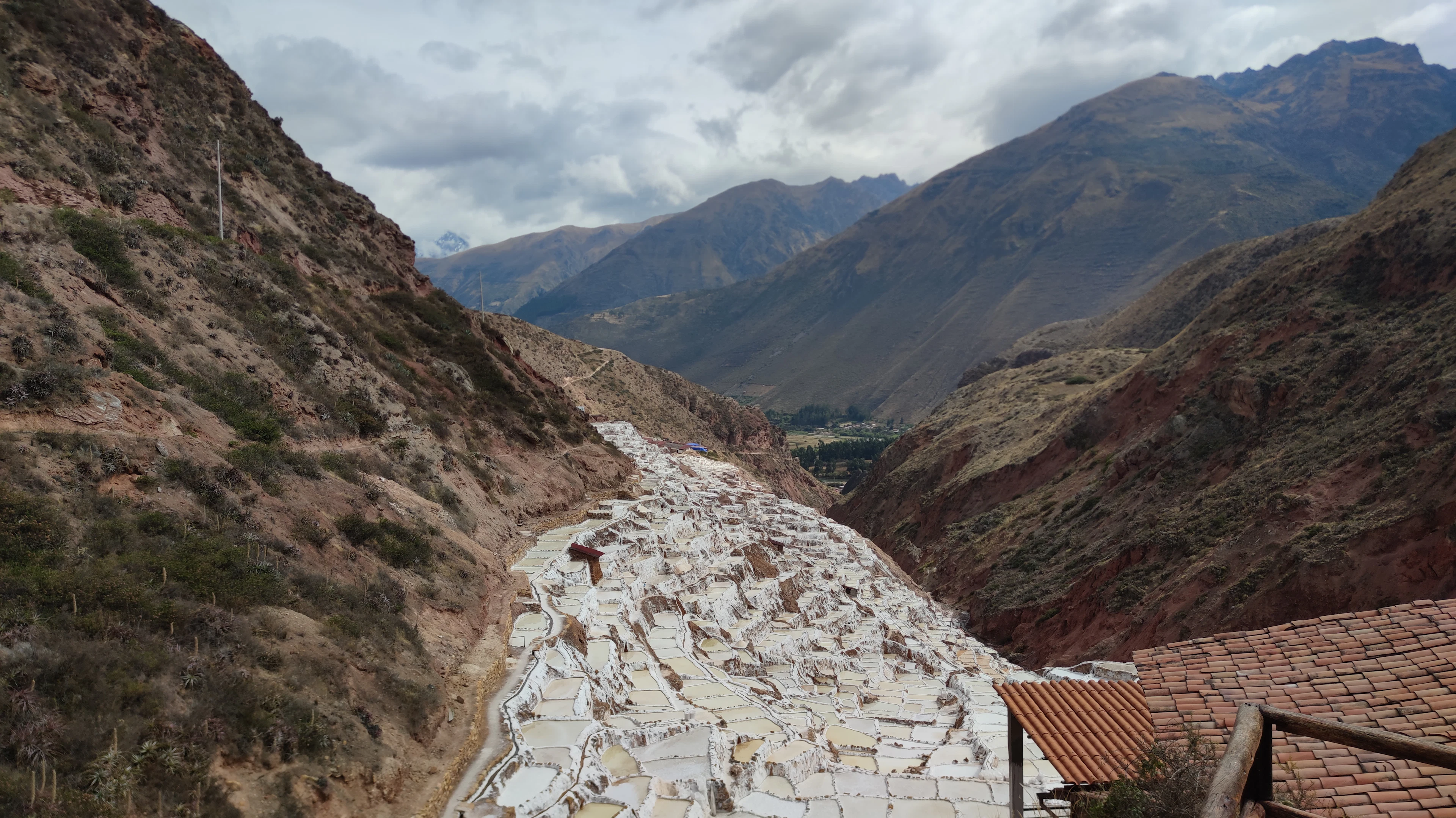 The terraced salt pans of Maras spilling down a narrow mountain valley in the Sacred Valley, Peru