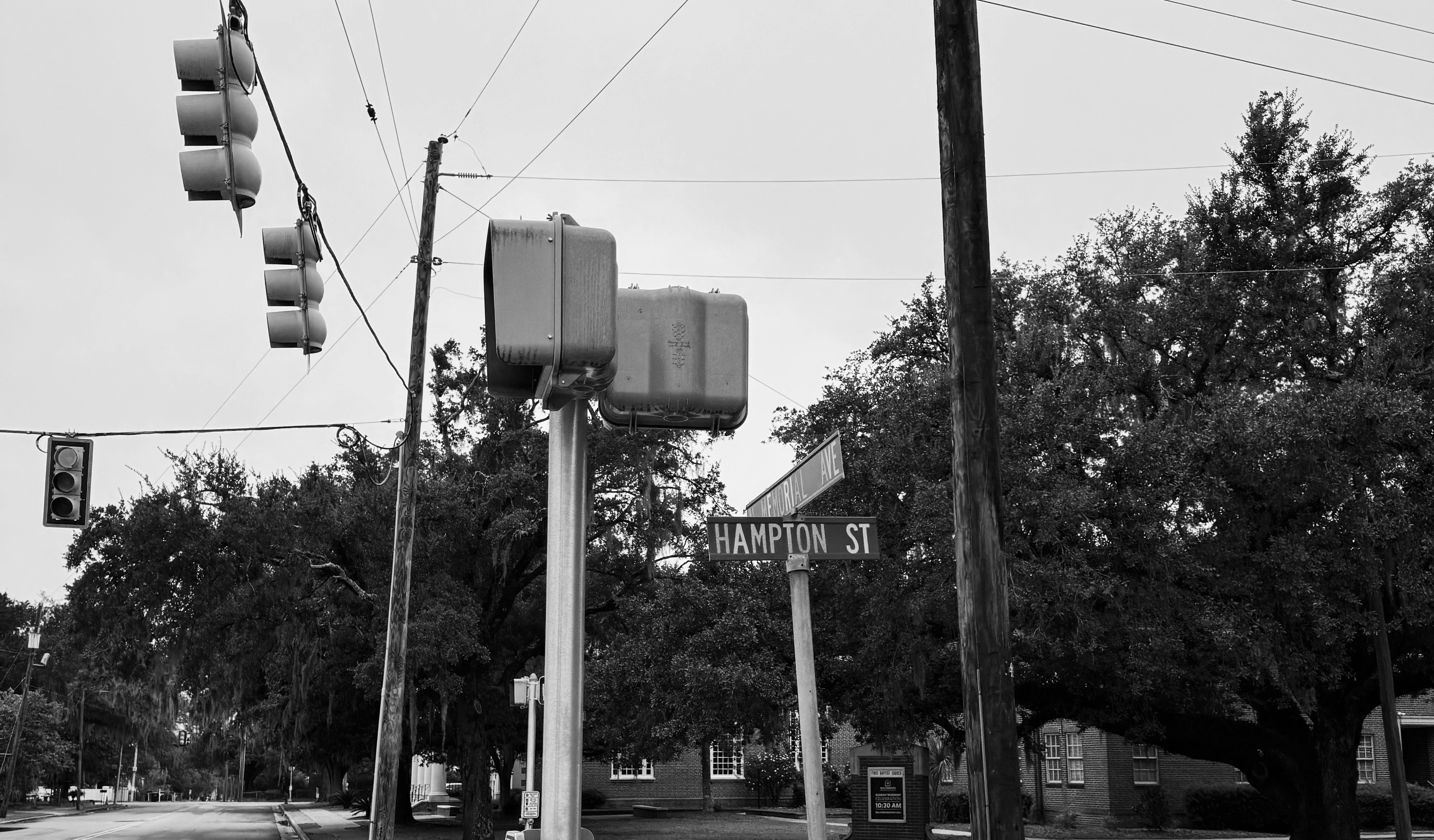 Performance electric SUV accelerating quickly through a city street