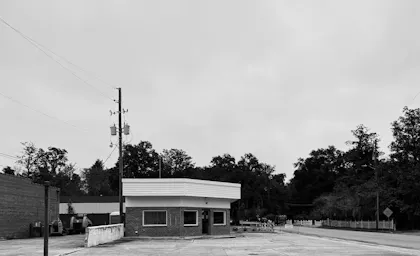 Small-town building under a cloudy sky