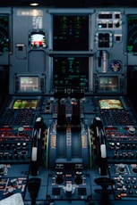 Airplane cockpit with illuminated displays and controls