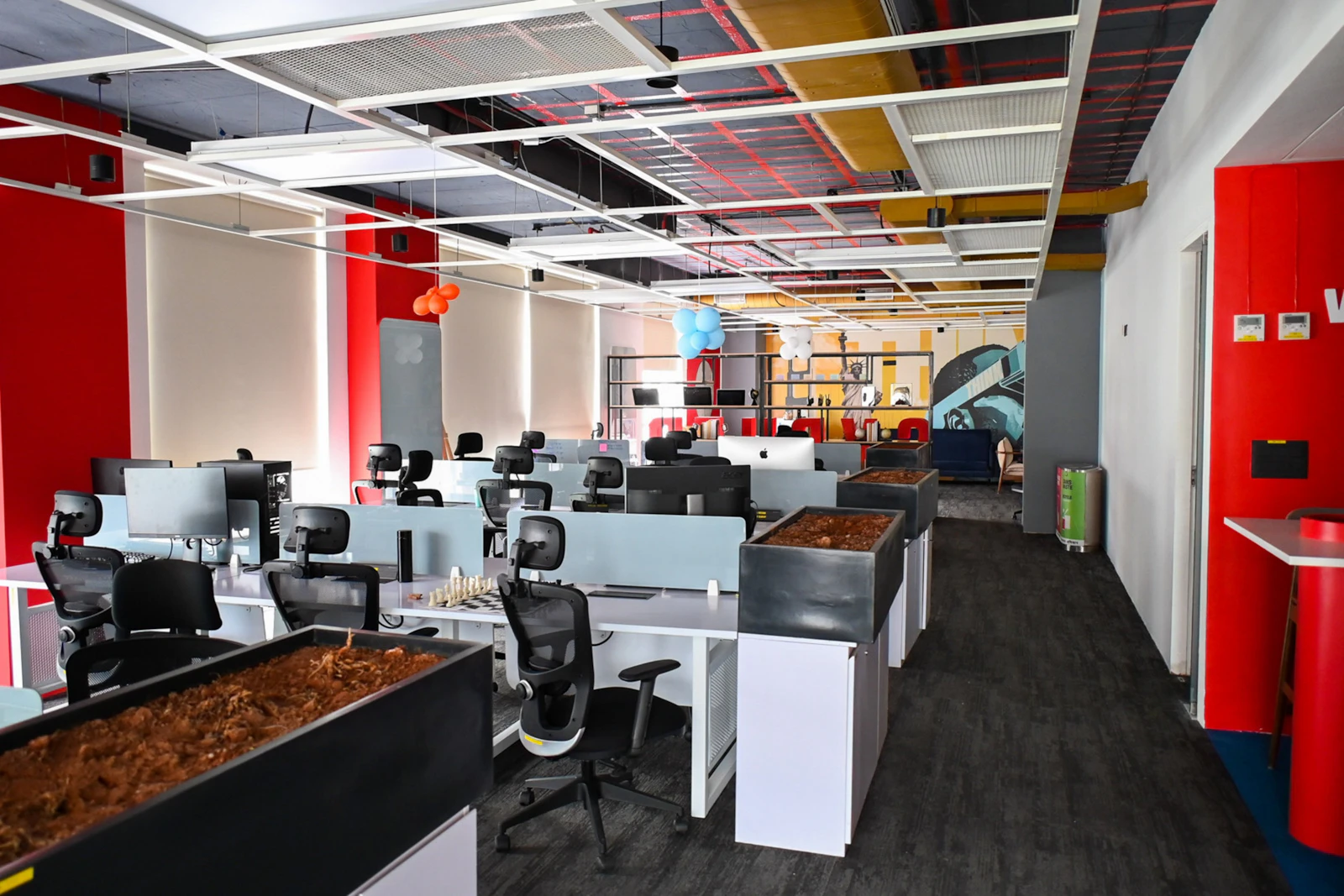 Glass-walled meeting room in a Dubai office with timber joinery and integrated ceiling lighting