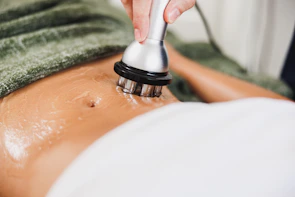 Abdomen treatment with a device and cream.