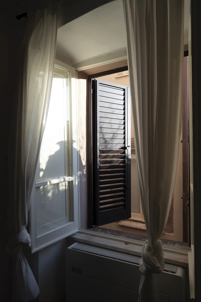 Soft morning light through a curtained window