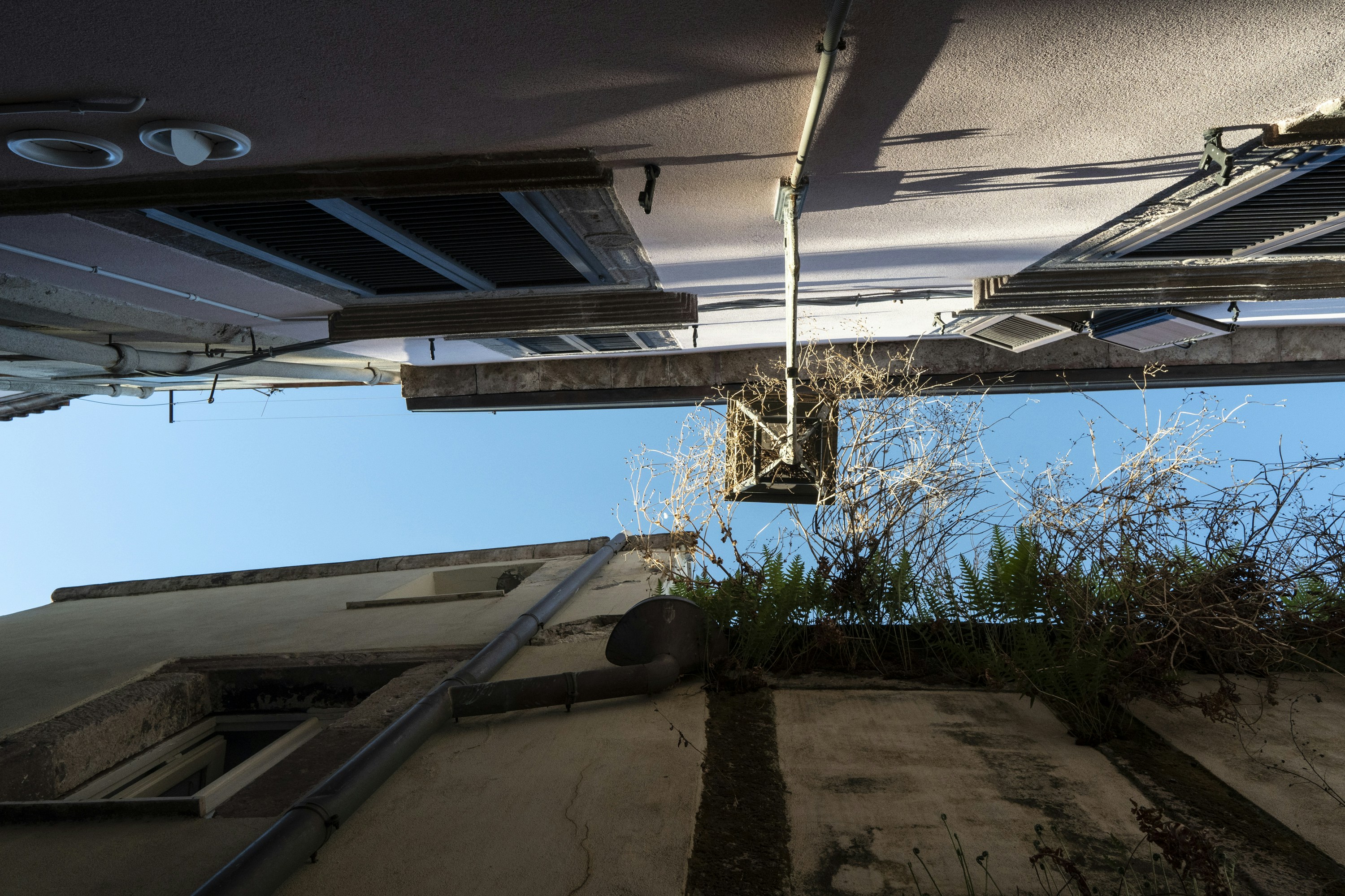 Looking up at buildings and blue sky