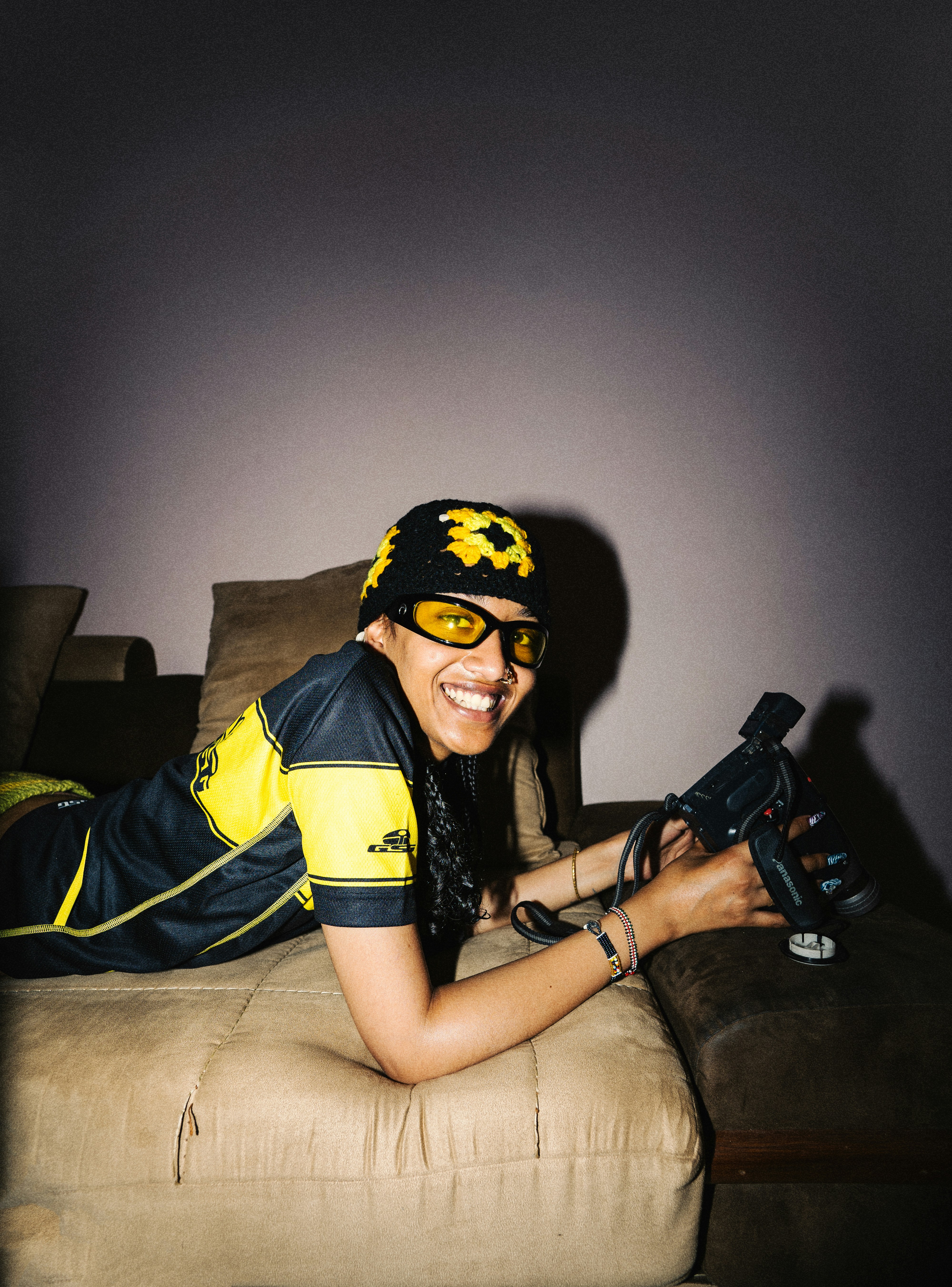 Woman in hat and goggles holding toy guns