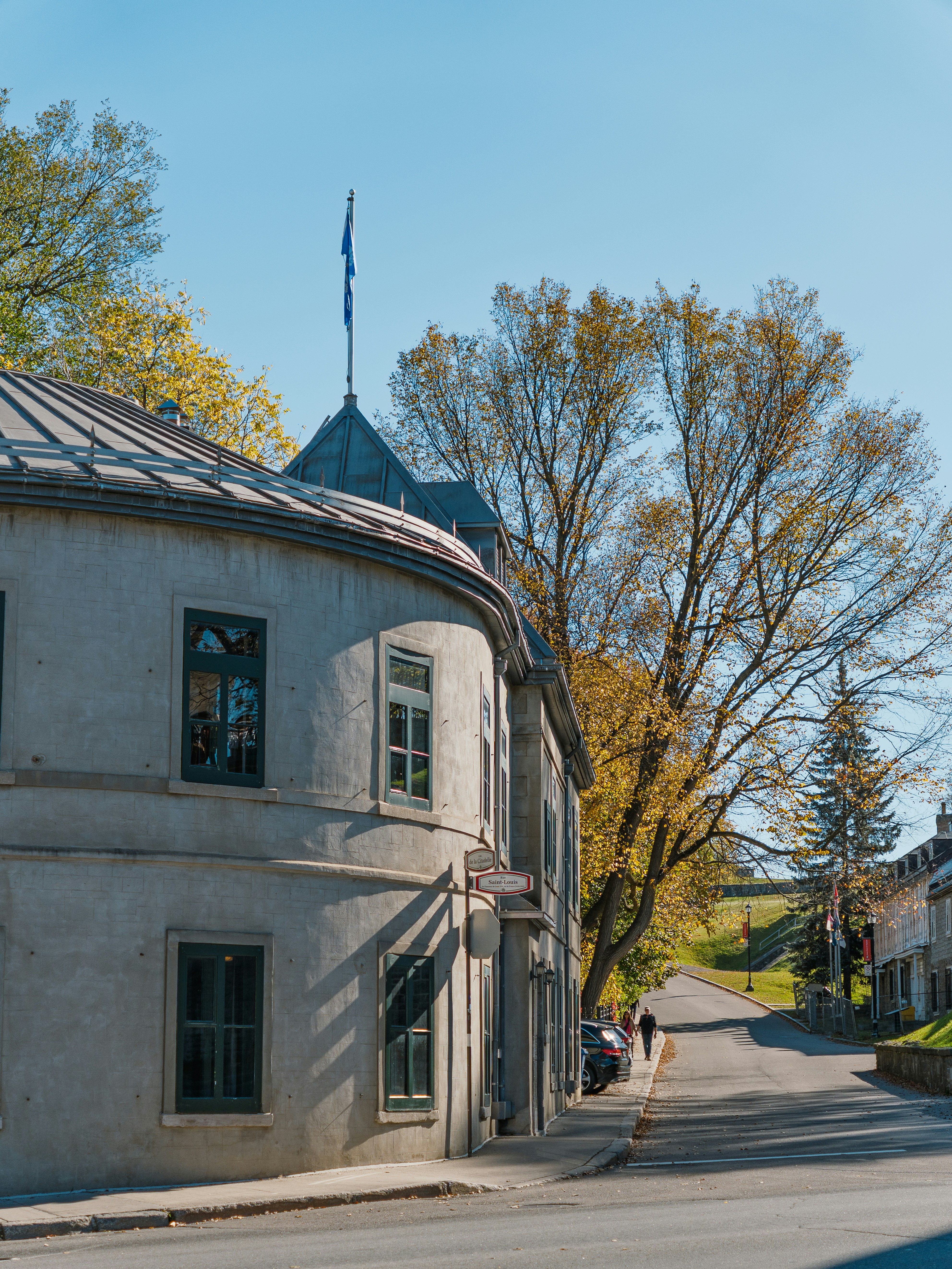 Curving historic building on a sunny street