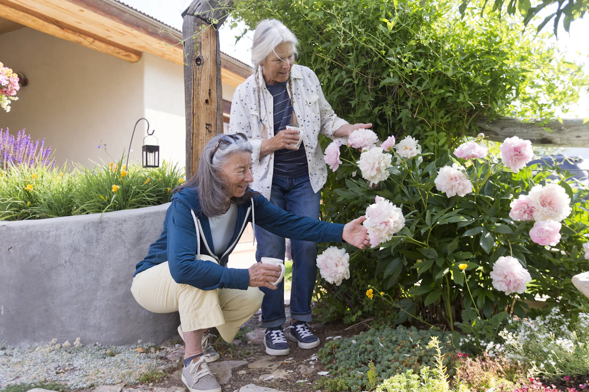 Two neighbors sharing a warm moment together in a garden