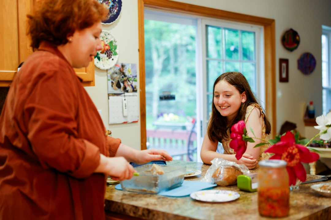 parent and teen talking seriously at kitchen table