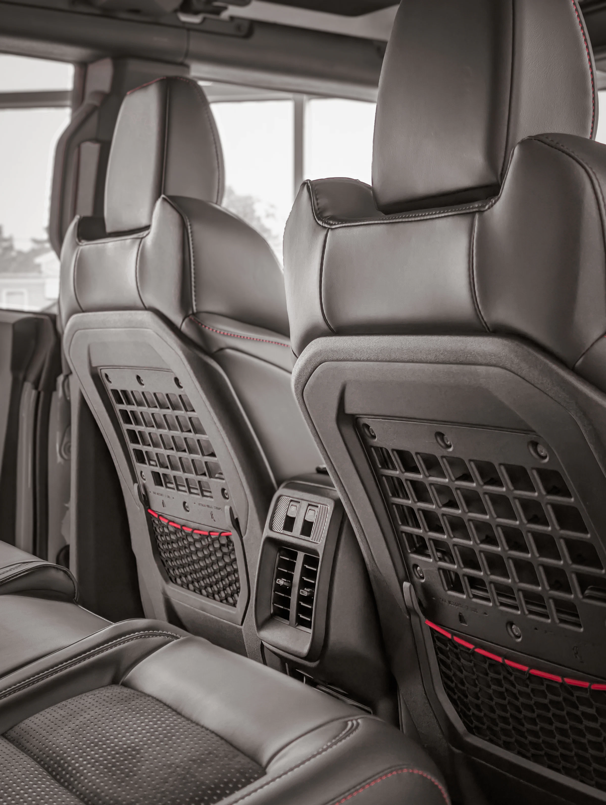 Organized rear car interior with integrated seat storage pockets