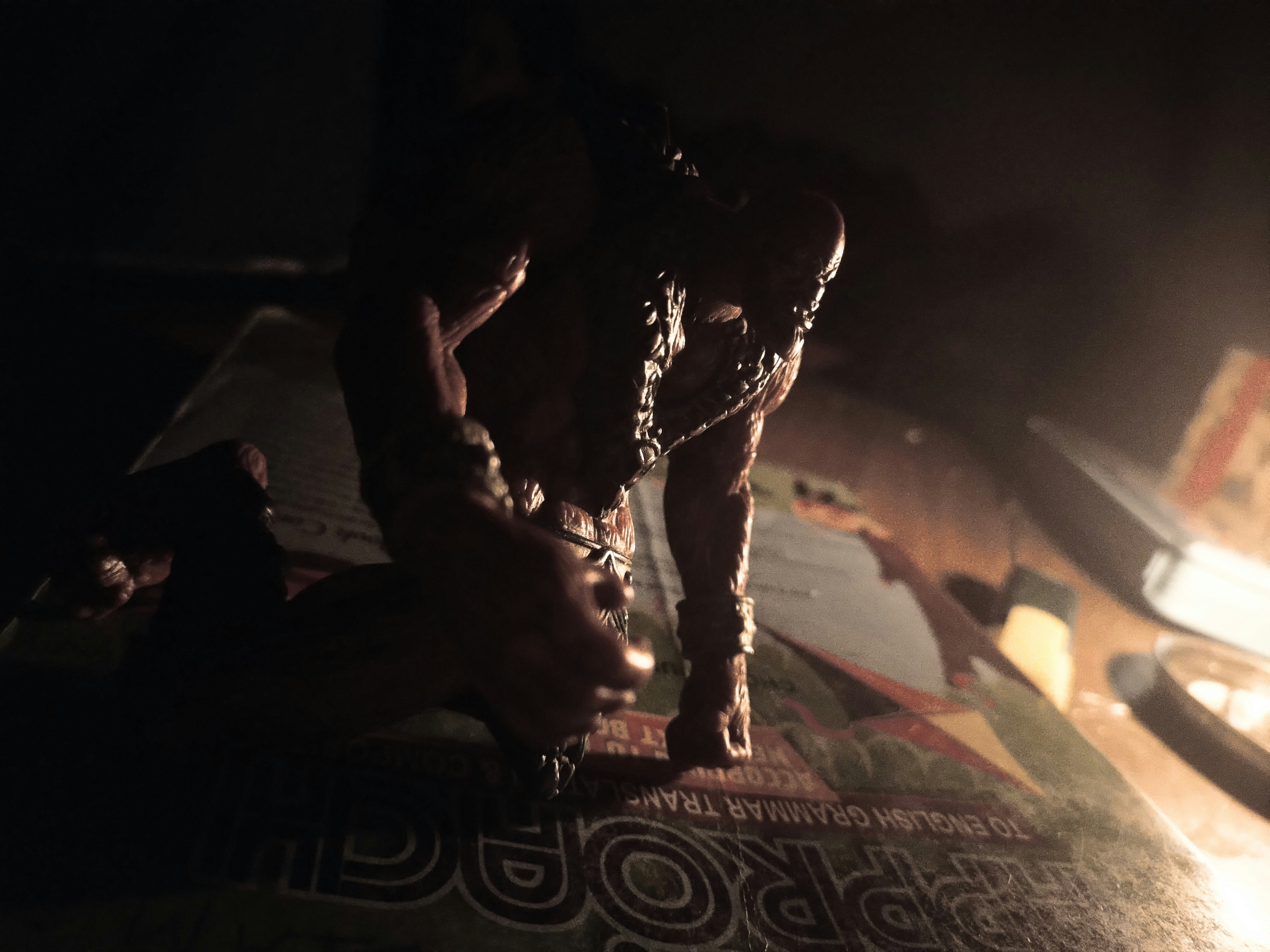 Dark, gritty monster figure on a table