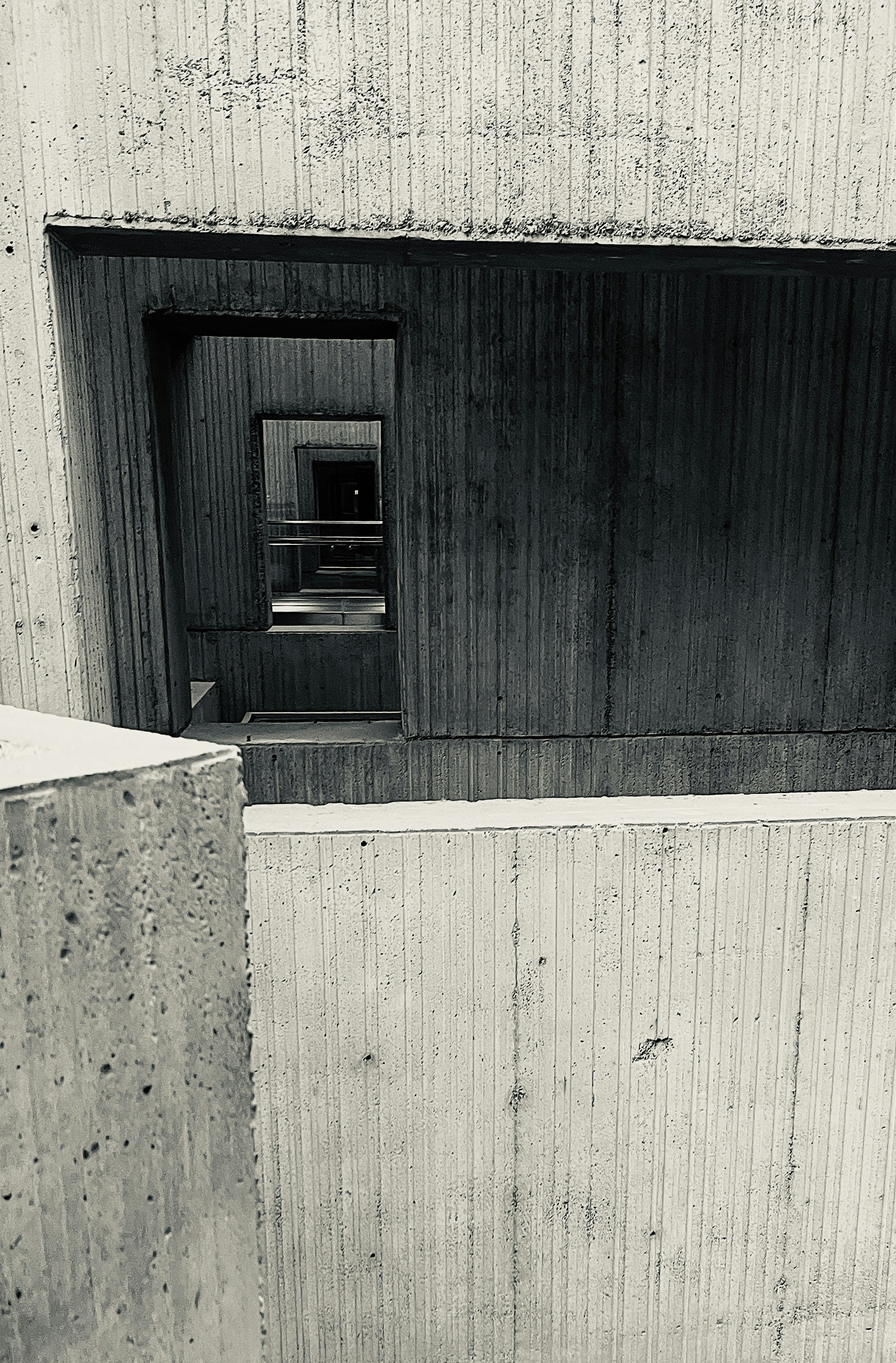 Concrete brutalist architecture with repeating geometric shapes.