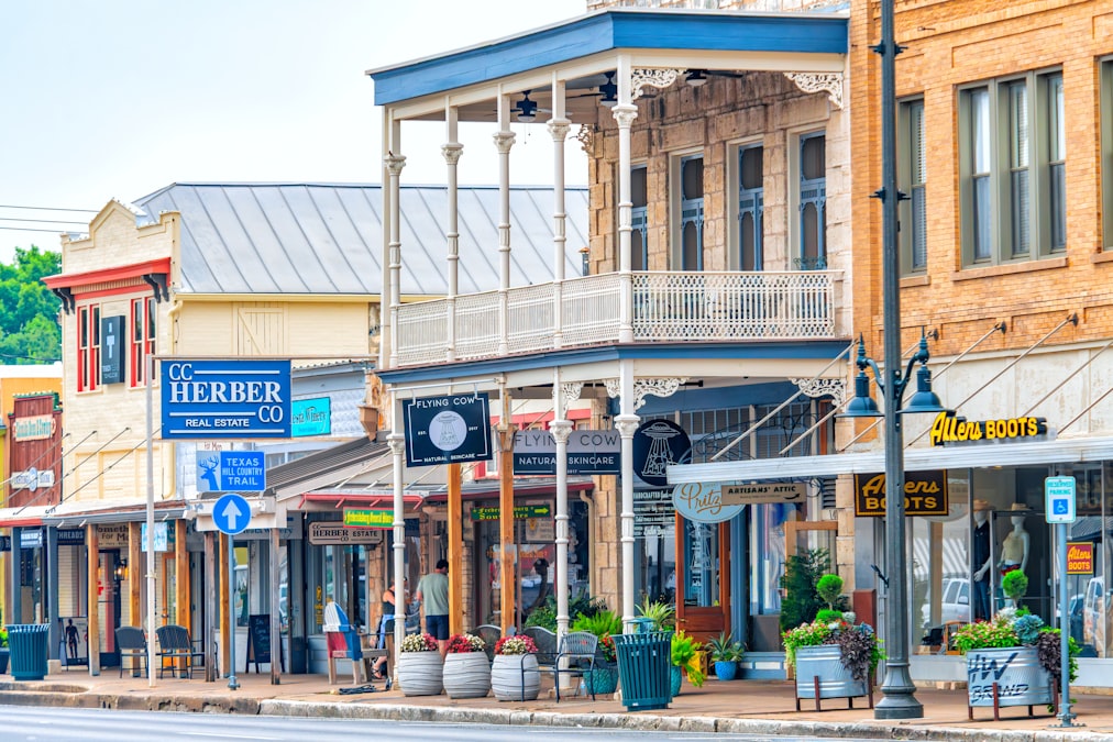 Historic small-town main street lined with character storefronts and brick facades, similar to Martinez's walkable downtown district