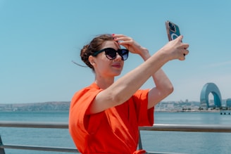 Woman taking a selfie with a smartphone