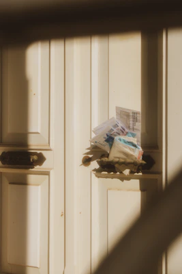 Mail piled up in a door slot