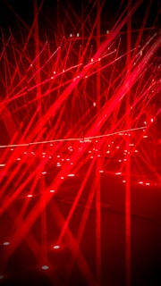 Red laser lights creating a vibrant abstract pattern