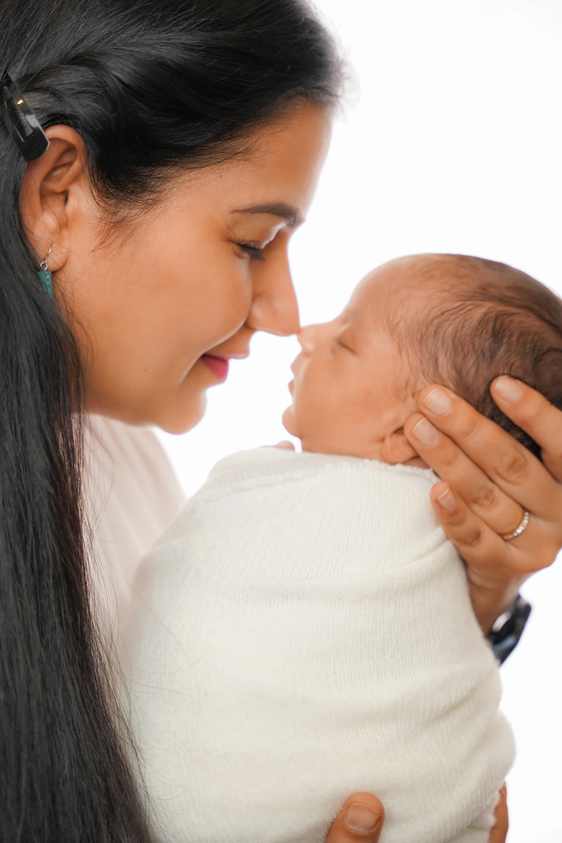 Mother and newborn baby in loving embrace