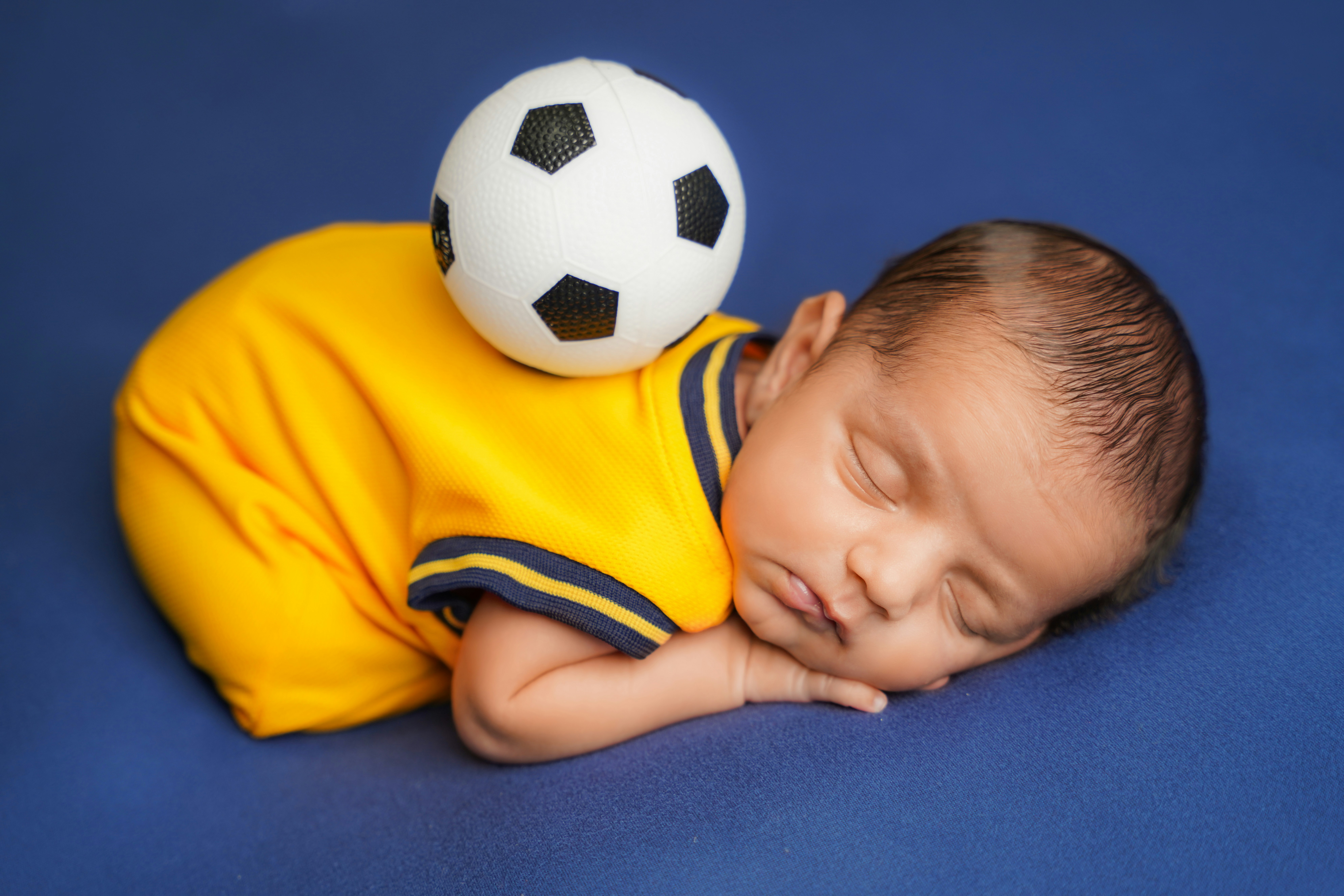 Parents choosing a football baby outfit online