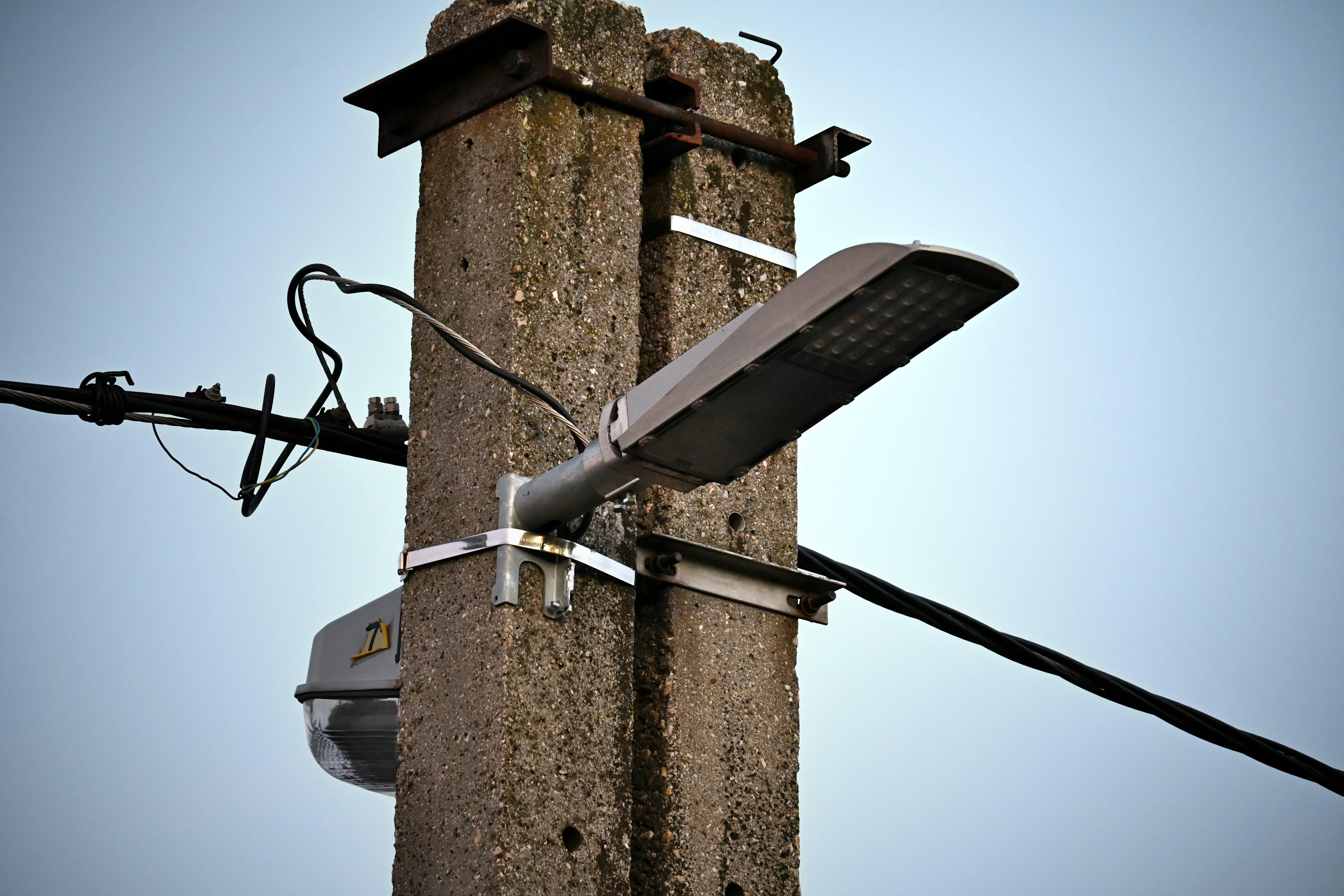 Streetlight attached to a concrete pole.