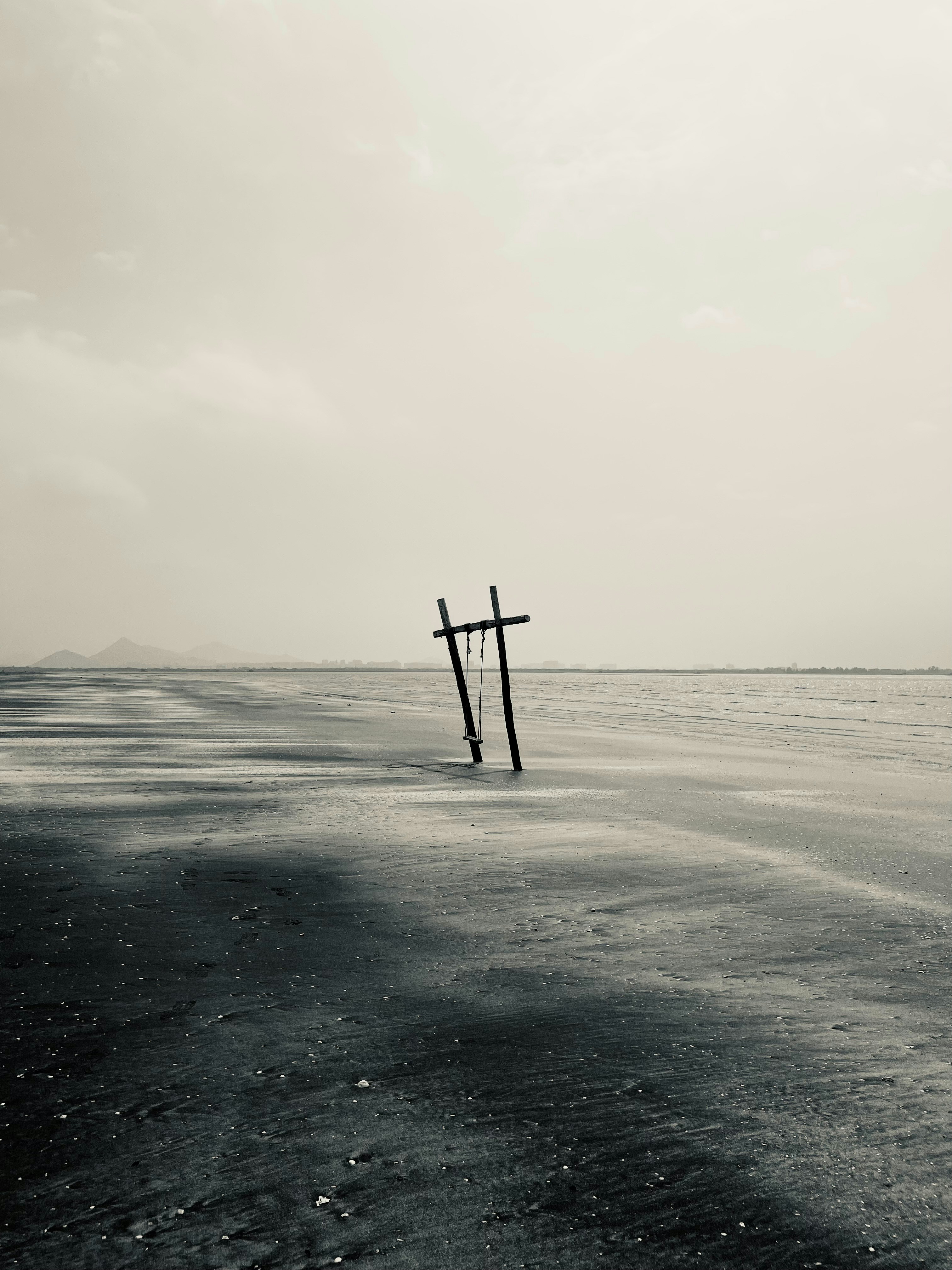 Wooden structure in a vast, desolate landscape