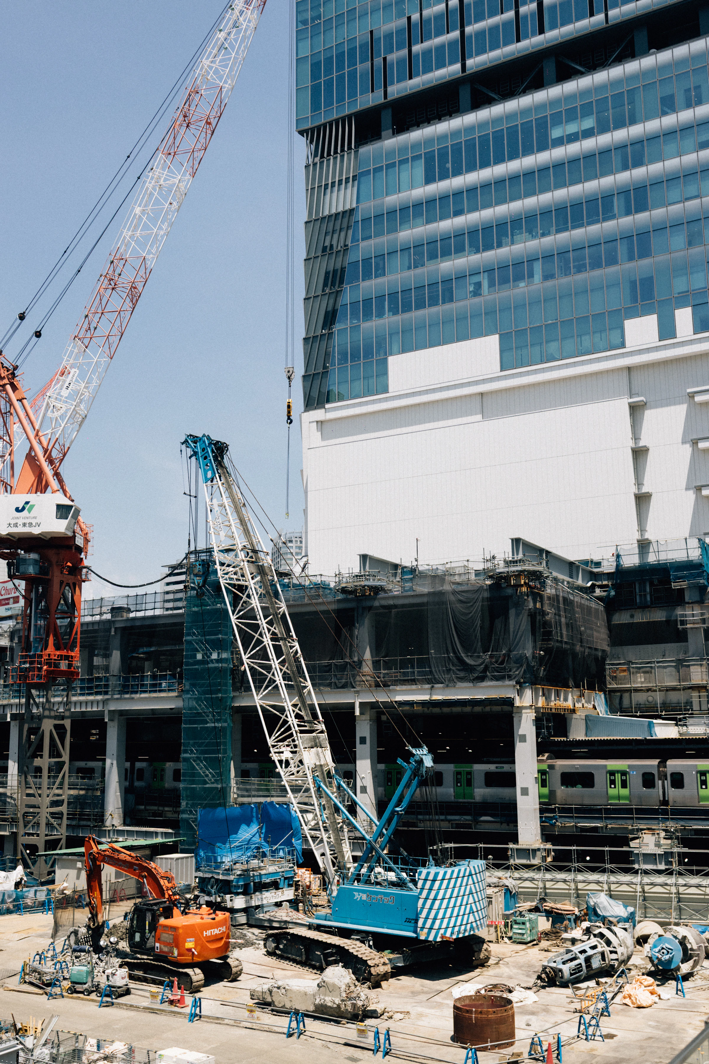 Cranes and structural work at an active construction site