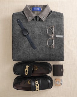 Flat lay of men's accessories and clothing