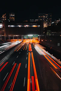 Light trails on a highway at night in a city.