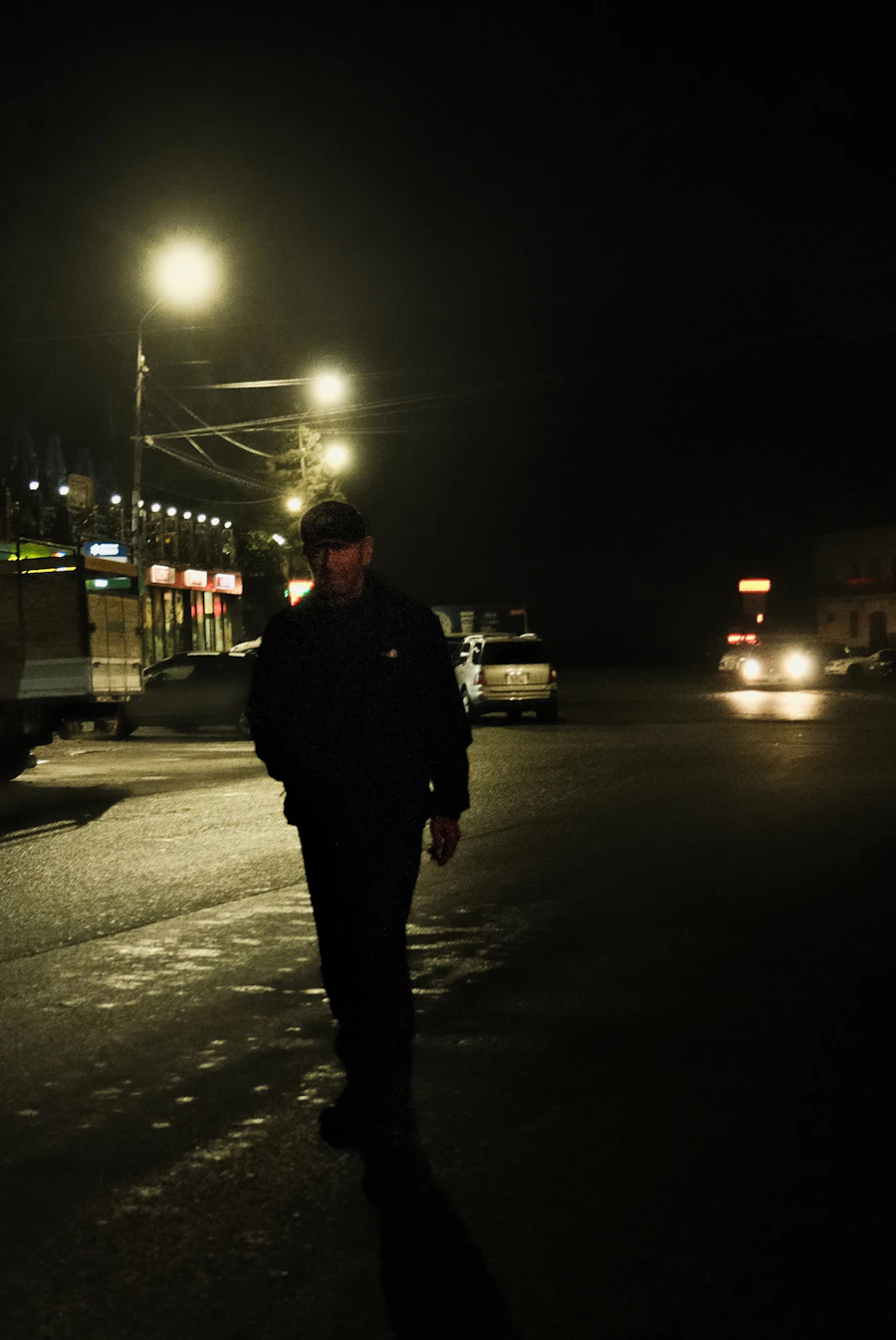 Man walking down a night street
