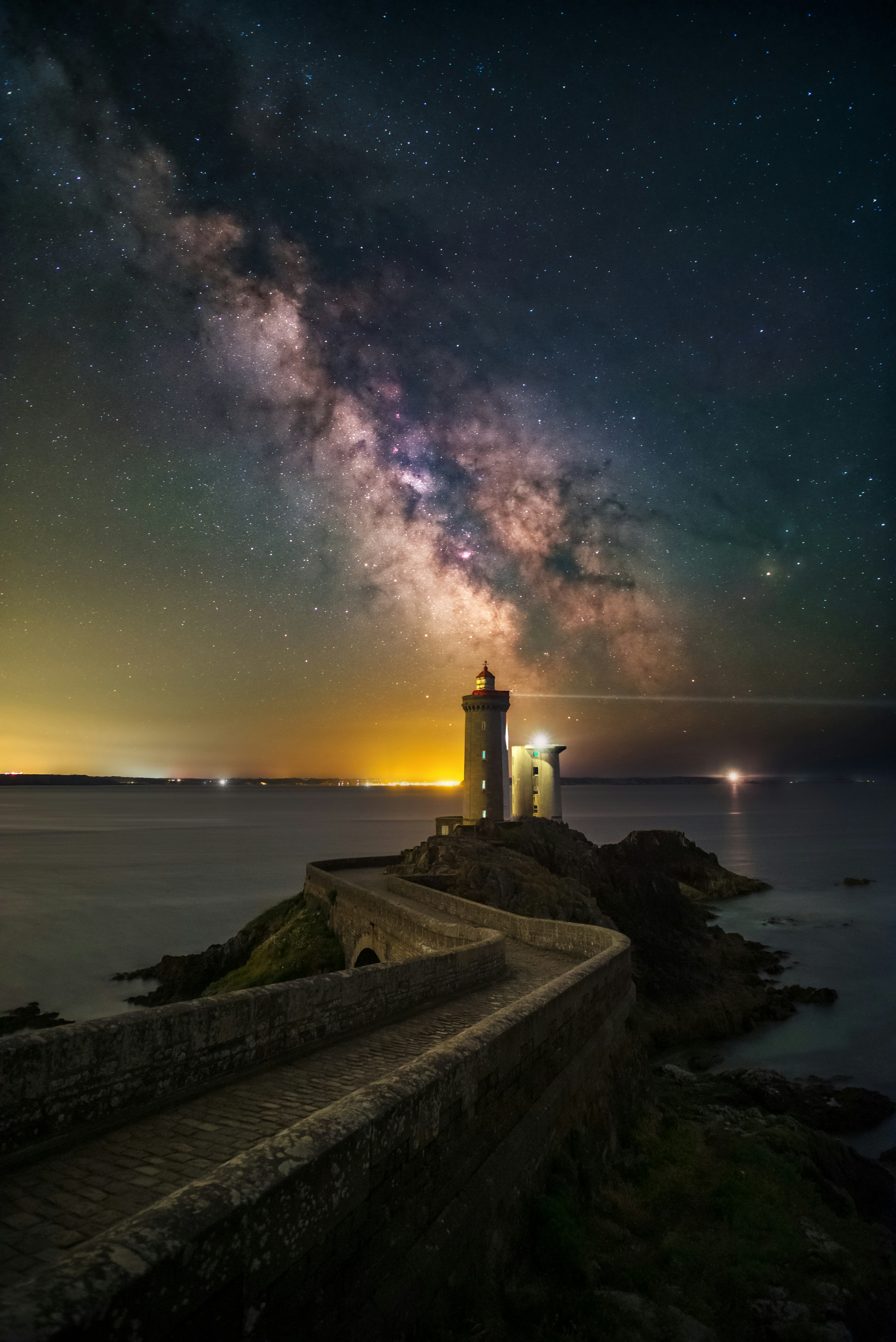 Lighthouse under the milky way galaxy