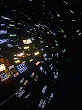 Abstract network of glowing screens in darkness