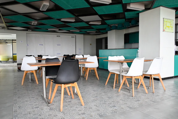 Modern cafe interior with tables and chairs