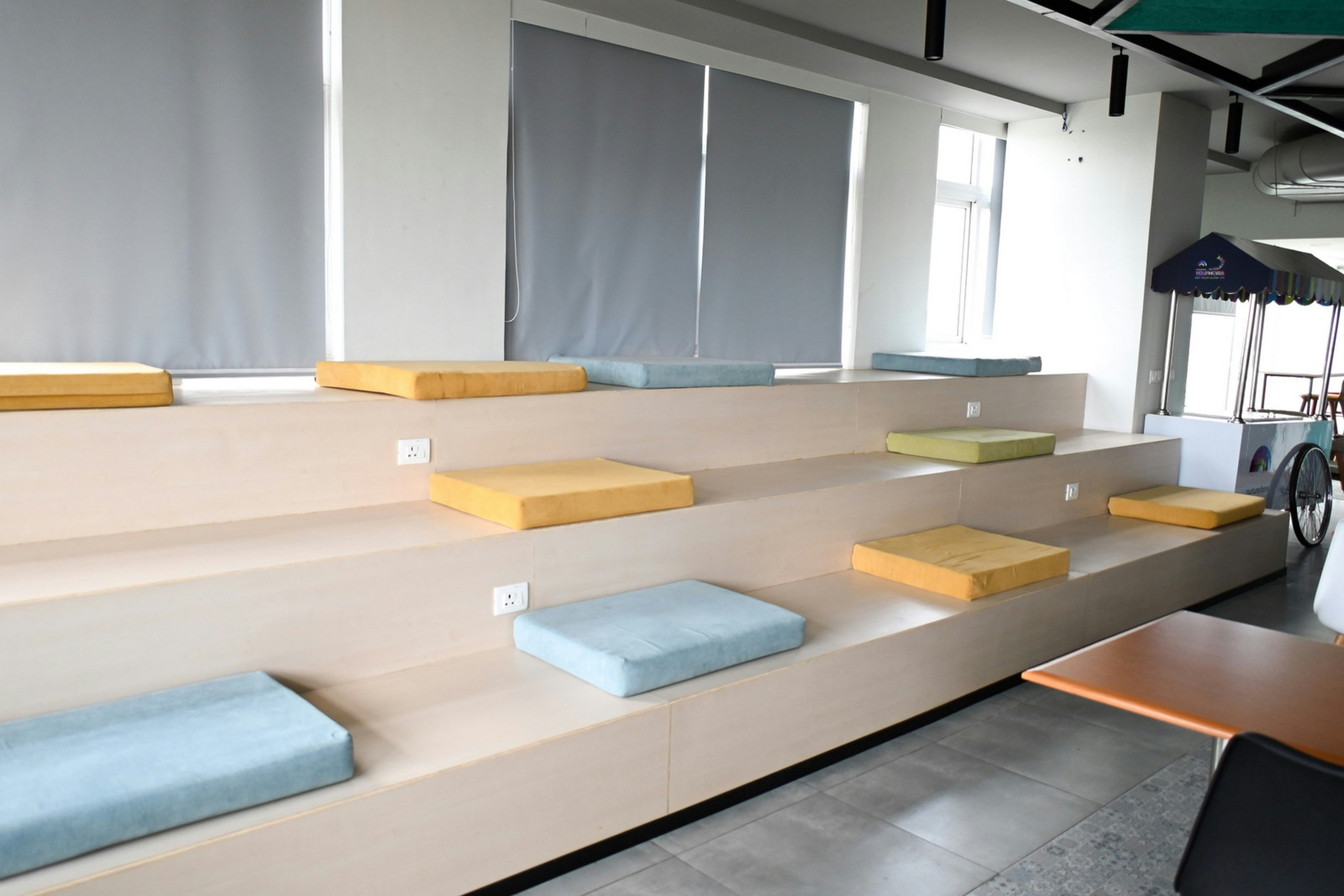 Tiered seating area with cushions