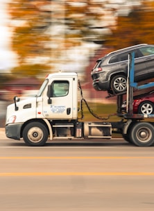 Car carrier truck transporting vehicles on a road