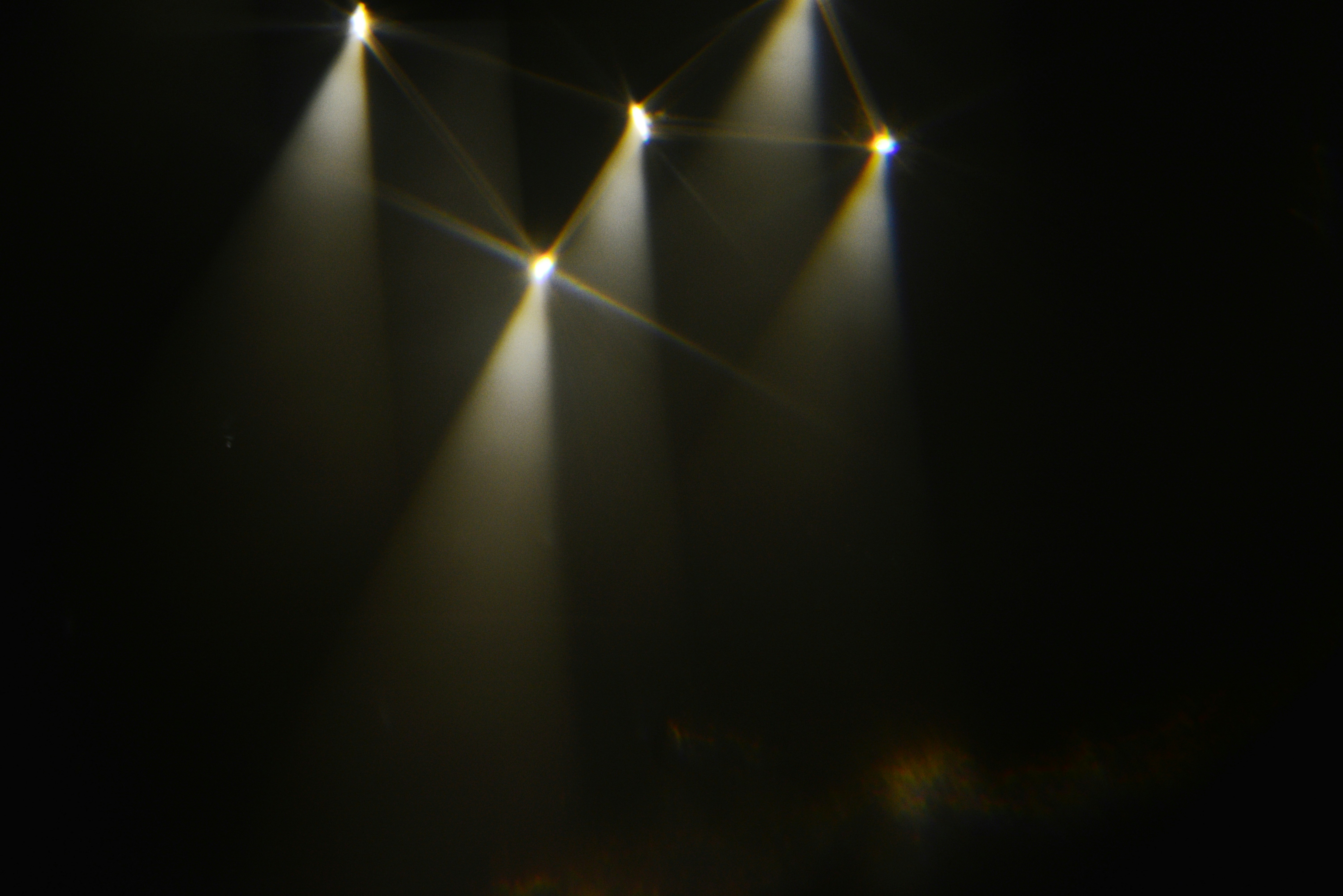 Stage lights illuminating a dark space with haze. photo – Free Spotlight  Image on Unsplash, image size:3000x2003