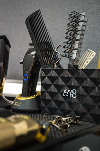 Barber tools in a holder with clippers