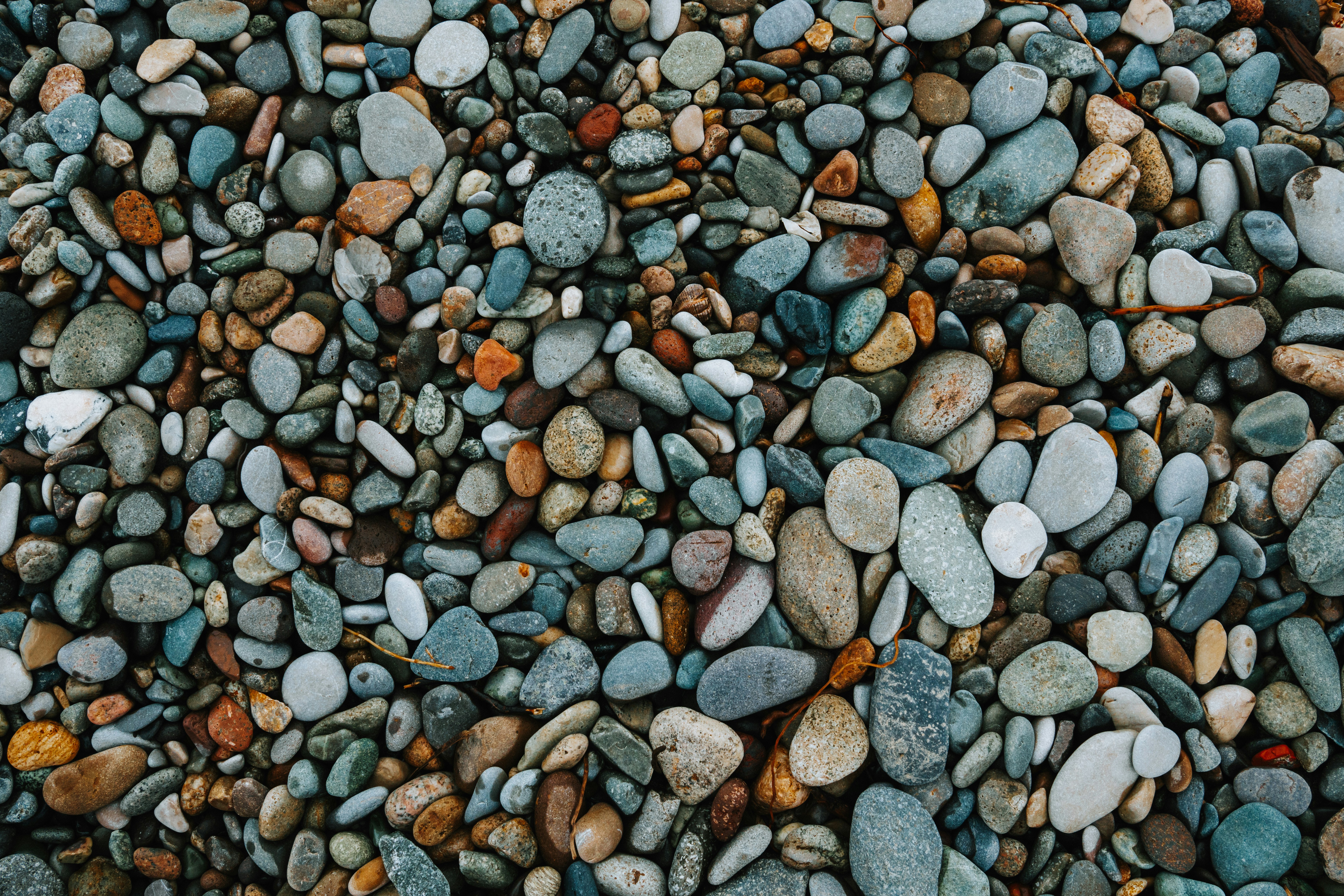 A collection of smooth, colorful pebbles on a beach. photo – Free  Background Image on Unsplash, image size:3000x2000