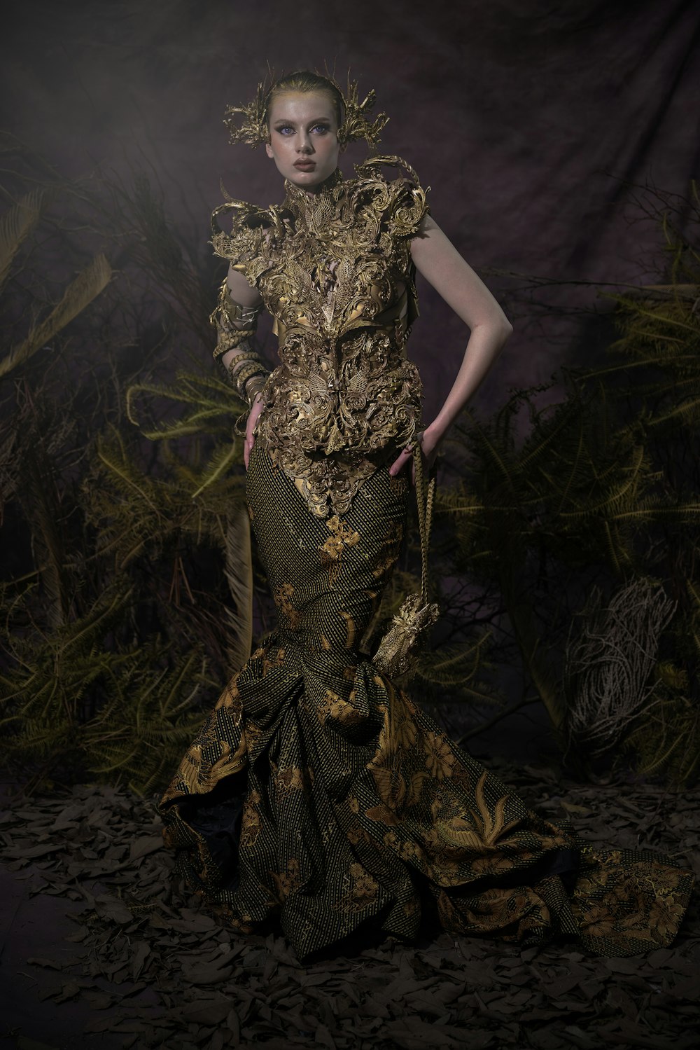 Exquisite haute couture gown with intricate detail and dramatic lighting