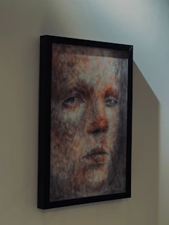 Framed abstract portrait of a pensive face