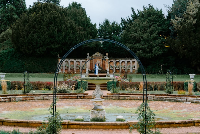 Couple in a formal garden at a Cotswolds estate