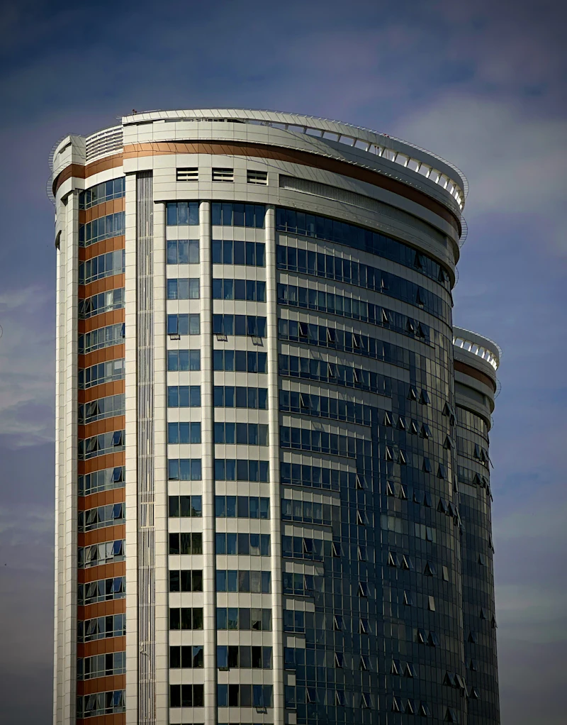 Modern skyscraper with glass windows against the sky