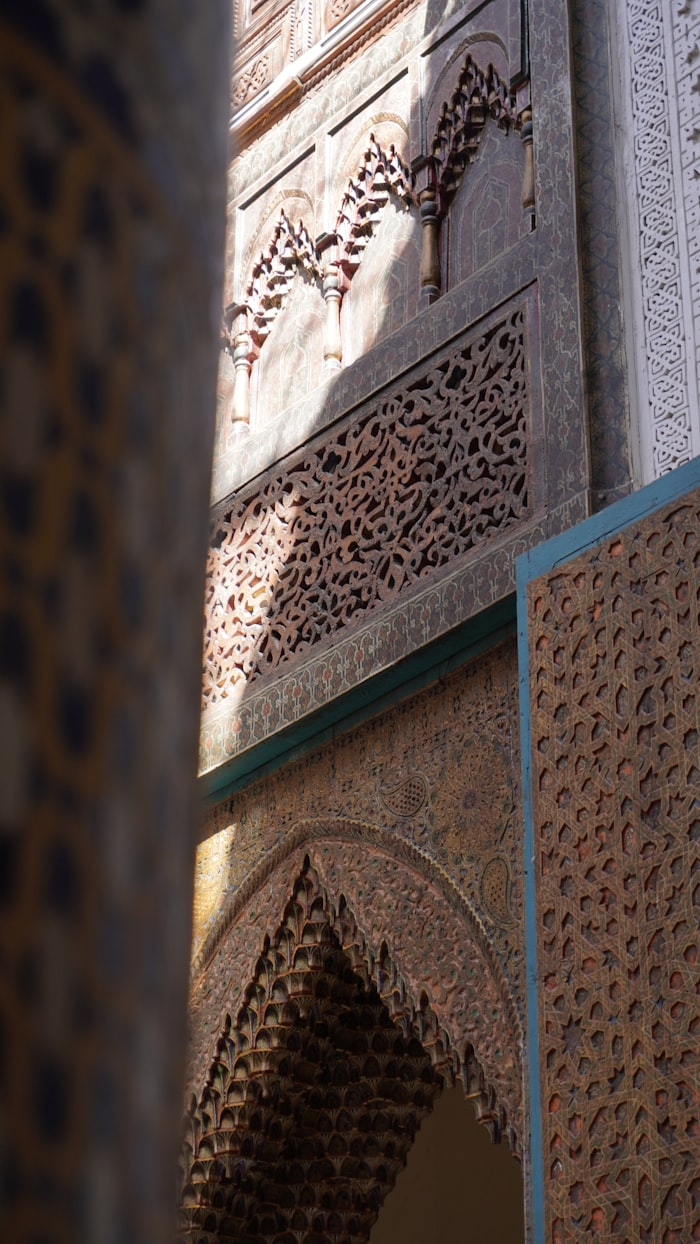 Carved plaster arabesques and cedar mashrabiya at Dar El Bacha, Marrakech