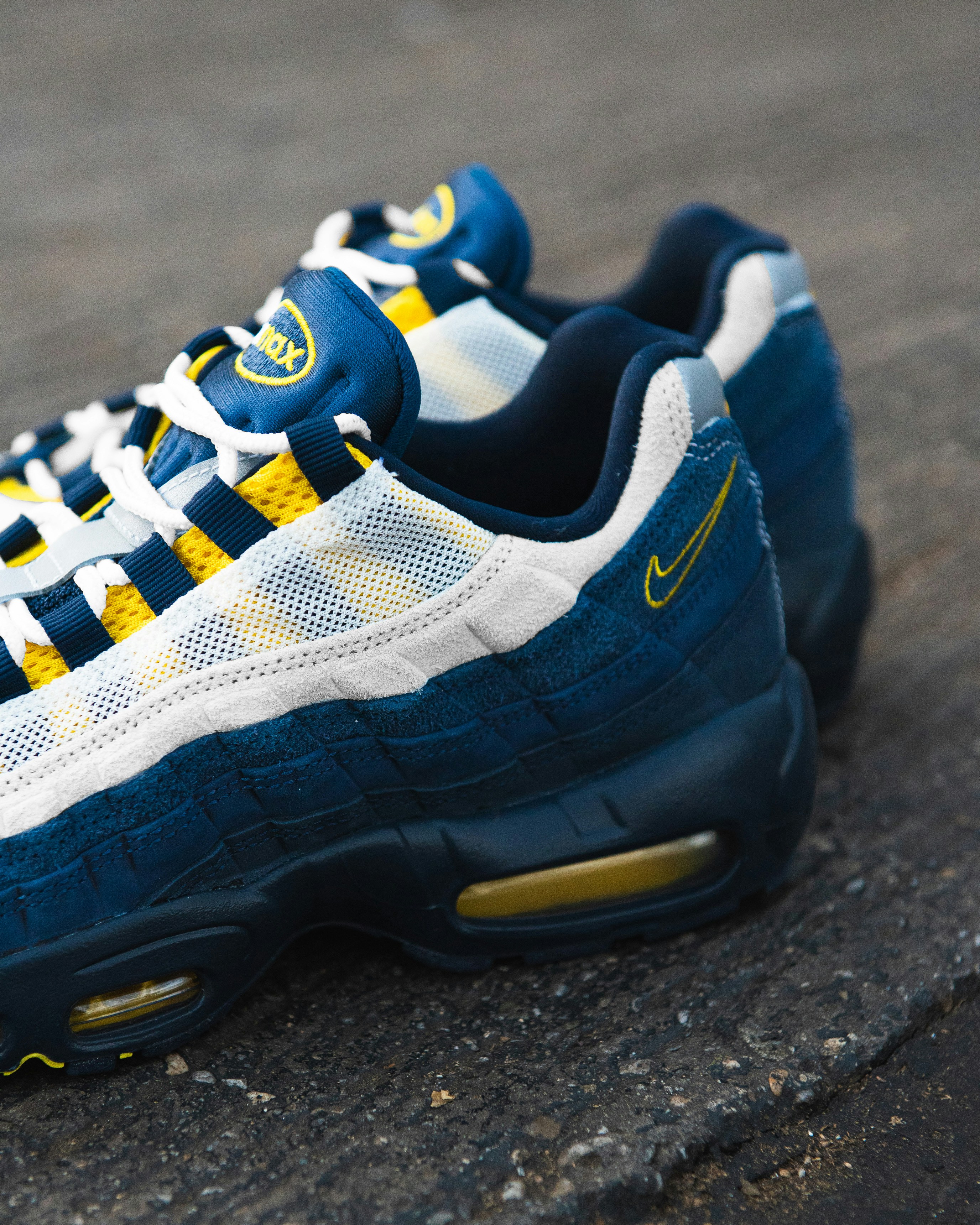 Close-up of blue and yellow nike air max sneakers.